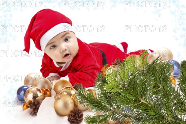 Baby in Santa costume. Christmas tree isolated on white