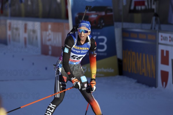 Franziska Preuß (SC Haag) crossing the finish line in the pursuit at the IBU Biathlon World