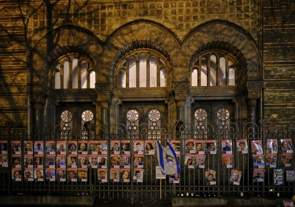 Germany, Berlin, 19 December 2024, Photos of Hamas hostages, fence in front of the New Synagogue,