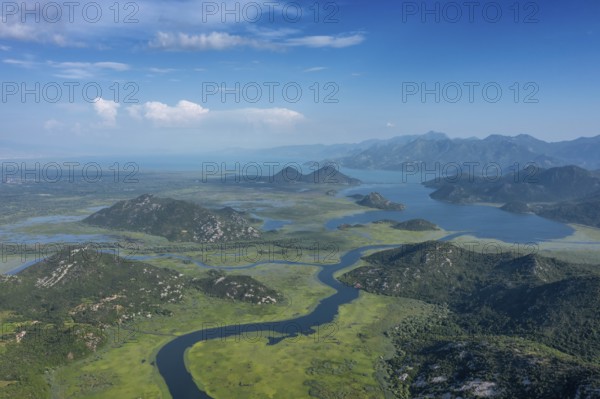Aerial view of Rijeka Crnojevica, beautiful river between mountains flowing into Skadar Lake,