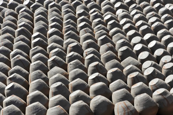 Ordered stacks of clay pots create a repeating geometric pattern, Kathmandu Valley. Kathmandu,