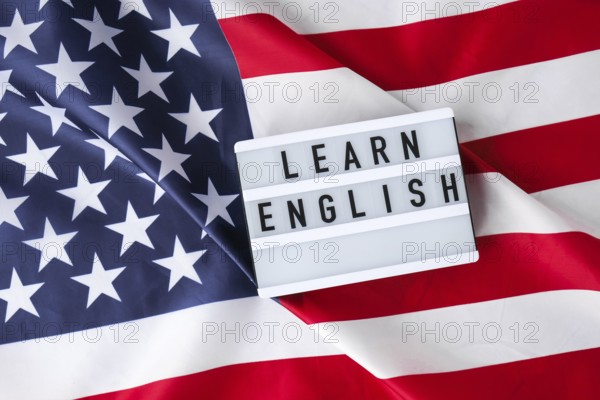 American flag. Lightbox with text LEARN ENGLISH Flag of the united states of America. July 4th