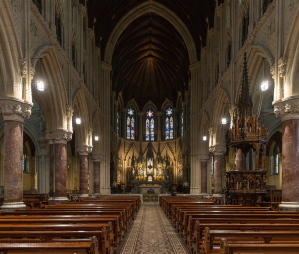 Cobh, Ireland, 15 August, 2022: view of the central nave and altar with the elegant wooden pulpit