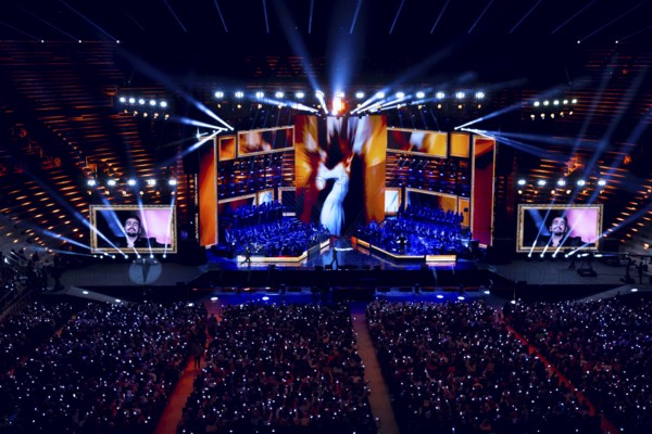 Large concert stage with spectacular lights and an enthusiastic audience, Il Volo concert, Arena di