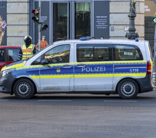 Police officer of the Berlin motorbike squad regulates traffic, Unter den Linden, Berlin, Germany,