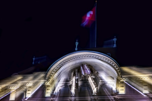 Beautiful Illuminated Swiss National Bank and Swiss Flag at Night in City of Bern, Bern Canton,