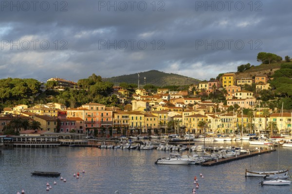 Porto Azzurro, Italy, 12 November, 2023: view of the harbor marina and Porto Azzurro village on