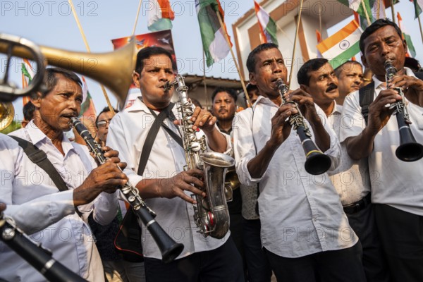 Band members play music as they take part in a rally, in soliderity with the Indian armed forces in