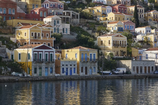 Colourful houses on the shore with water view, Symi Town, Symi, Dodecanese, Greek Islands, Greece,