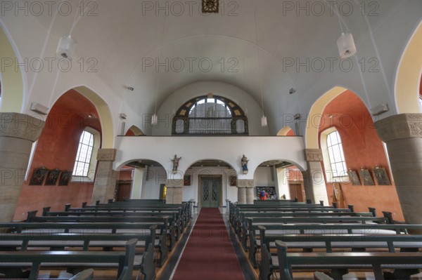 Interior with organ loft of St Stephen's Church, Art Nouveau building designed with neo-Romanesque
