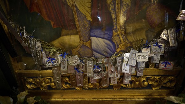 Interior view of a church with magnificent frescoes on the walls and a window letting in light,