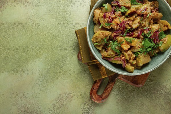 Fried green tomatoes, with onions and spices, green tomato appetizer, Georgian cuisine, homemade,