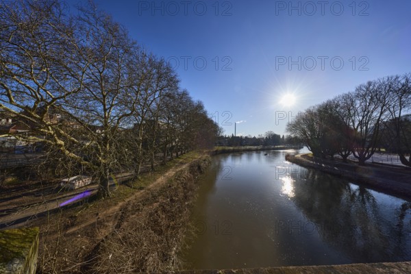 River Saar, bank, trees, meadow, abstract reflections, water surface, backlight of the sun, blue