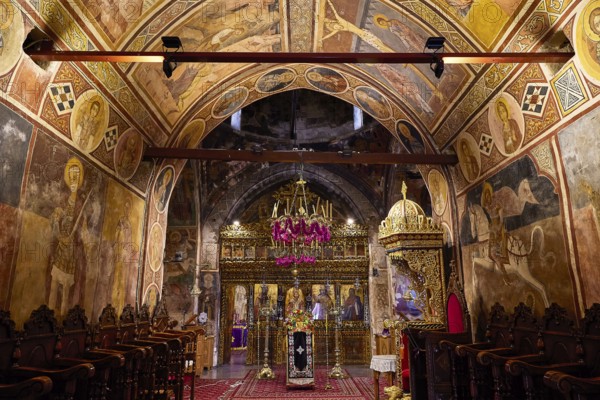 Ornamental church interior with frescoes and a magnificent iconostasis, monastery, Moni Thari, near