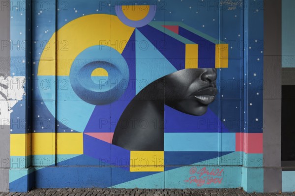 Realistic face with VR glasses made of geometric shapes, 3D portrait, mural by street artist SKIO,