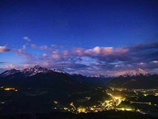 Starry sky at dawn over the valley basin of Berchtesgaden, behind Hoher Göll, Steinernes Meer and