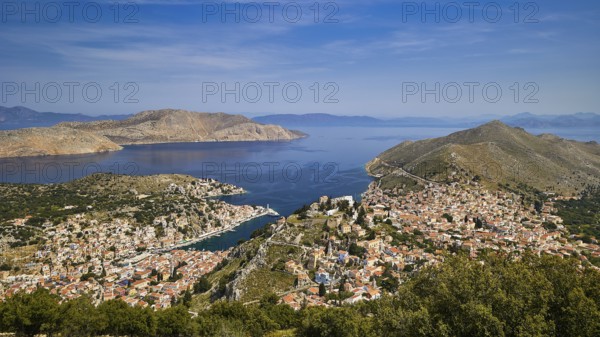 Wide island panorama with deep blue sea and sky, emphasises a peaceful atmosphere, Symi Town, Symi,