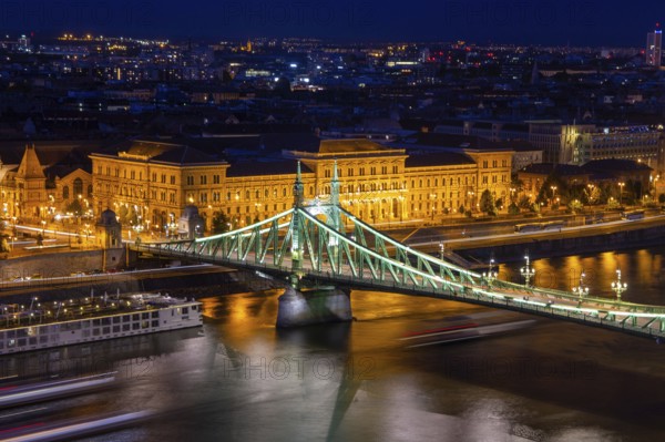 Evening panorama of Budapest with the Danube and the Liberty Bridge in the foreground