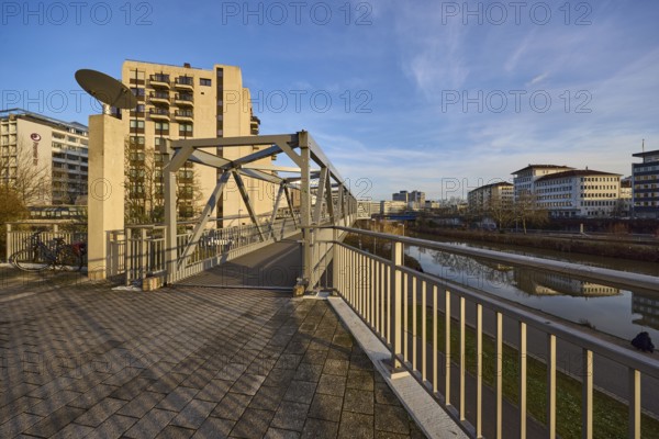 Modern architecture, footbridge, metal railing, river Saar, blue sky, cirrostratus clouds, evening