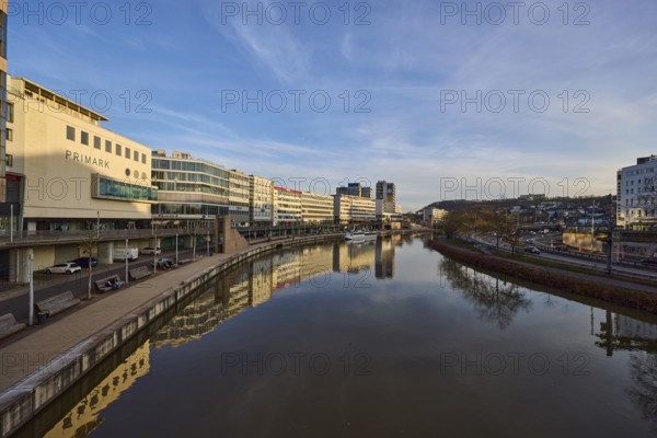River Saar, modern architecture, trees, reflections on the water surface, fashion shop, Primark,