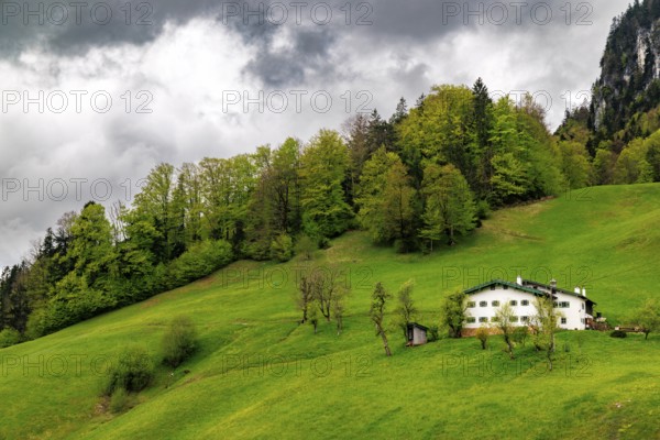 Old farmhouse in Maria Gern under dark clouds, Berchtesgaden, Berchtesgadener Land, Upper Bavaria,