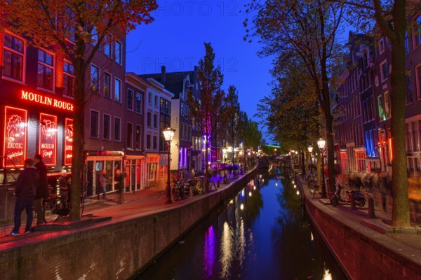 Night view of De Wallen, the famous red-light district with window prostitution in Amsterdam,