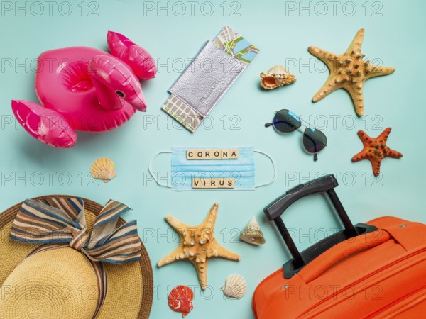 Coronavirus covid-19 and travel concept. Summer vacation and beach rest symbols and breathing mask