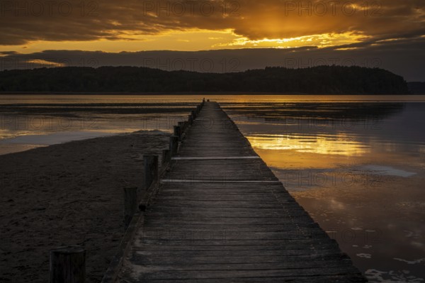 Sunset over the Jasmunder Bodden coast, with the pier in Lietzow, Mecklenburg-Western Pomerania,