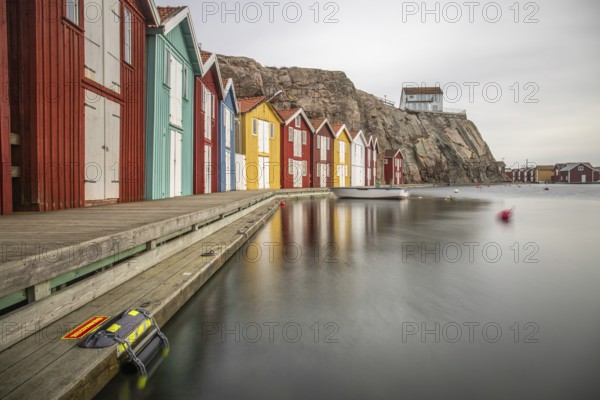 Small colourful houses by the sea. Typical houses in Sweden for the coastal landscape. Crab fishing