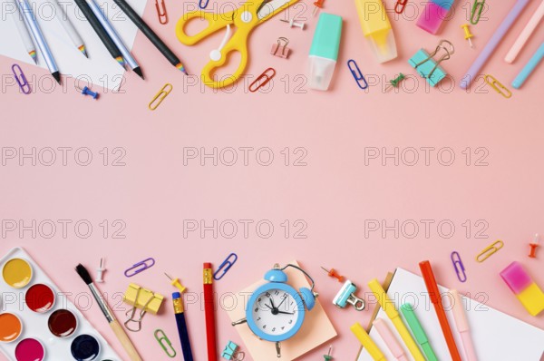 Creative student desk with school supplies and copy space in center. Top view or flat lay. Trendy