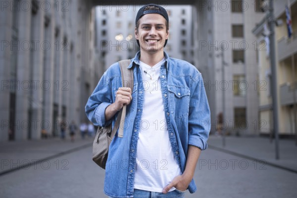 Background on the street while waiting his colleagues. Businessman wearing casual white shirt and