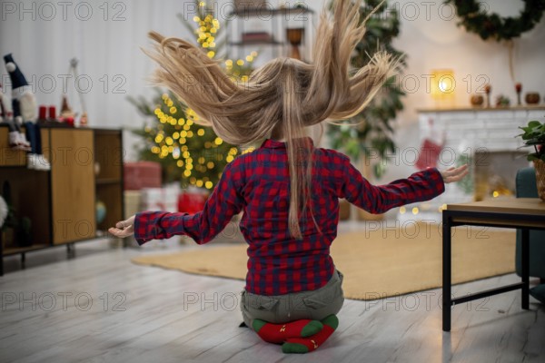 A joyful moment that beautifully captures the festive spirit with a playful young girl celebrating