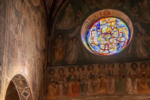 SAN GIMGNANO, ITALY, SEPTEMBER 20, 2023, Colorful old frescoes at the main aisle of the cathedral