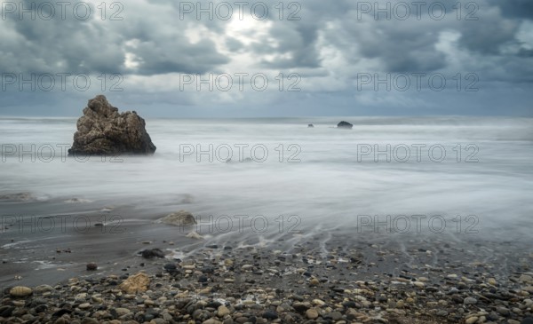 Seascape with windy waves during storm weather at the rocky coastal area of the Rock of Aphrodite