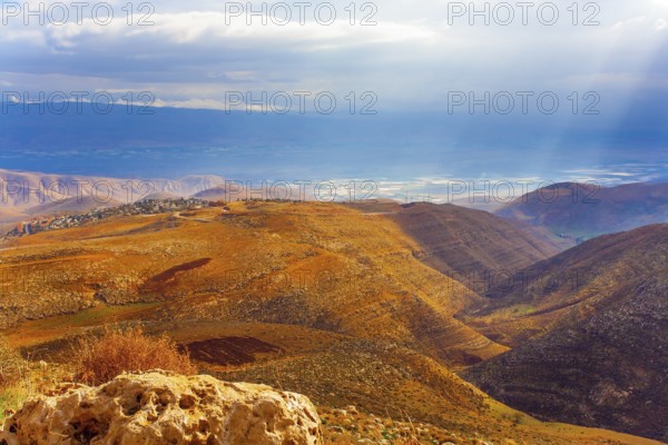Legendary Dead Sea. Ancient terracotta-colored mountains surround the healing waters of the Dead