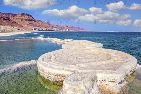 Evaporated salt forms beautiful, symmetrical crystals on the surface of the water. The saltiest
