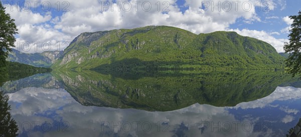 Mountain range reflected in Lake Bohinj, Triglav National Park, Julian Alps, Gorenjska region or