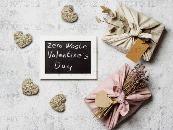 Zero waste Valentine's Day concept. Eco-friendly gift cloth wrapping in Furoshiki style and