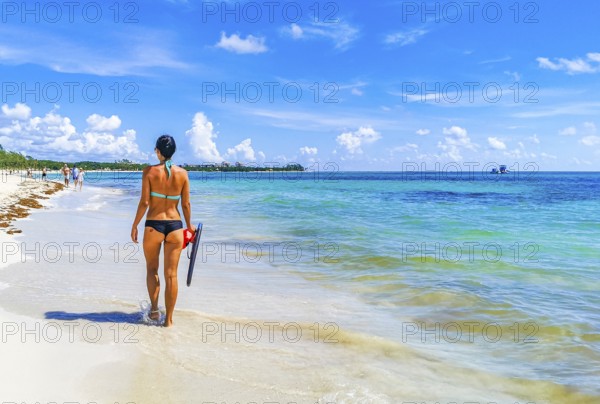 Sexy lady girl pretty woman walks on the tropical mexican beach with turquoise clear water on Playa