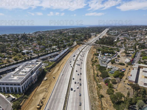 Aerial view of highway transportation with small traffic, highway interchange and junction, San