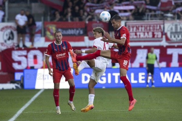 Football match, Ritsu DOAN SC Freiburg centre and Marvin PIERINGER 1. FC Heidenheim right in aerial