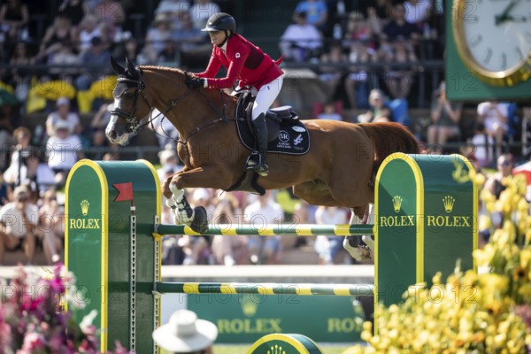 Erynn Ballard of Canada and riding De Flor 111 Z Santa Rosa compete in the first round of the 1.60m