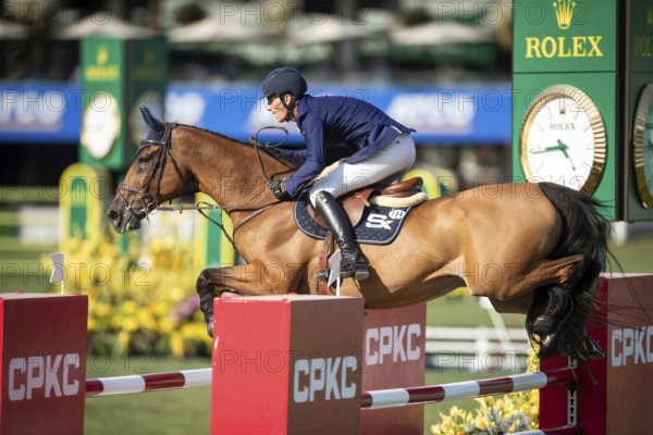 German rider Daniel Deusser riding Killer Queen VDM competes in the second round and jumpoff of the