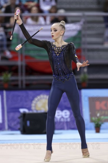 Sofia, Bulgaria - 1 April, 2018: Olena Diachenko Ukraine performs with clubs during Rhythmic