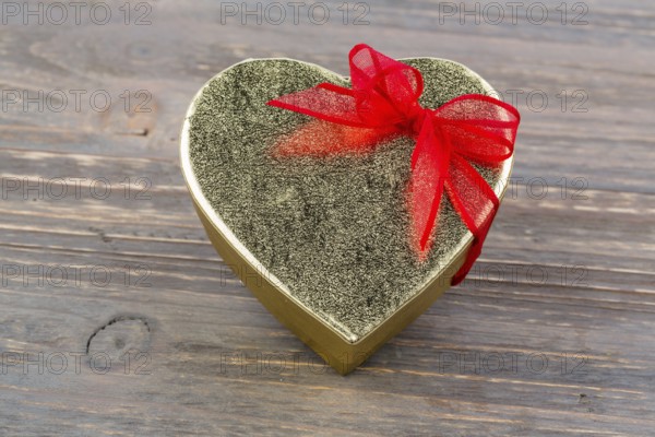 A box for a gift in the shape of a heart. Symbolic photo for Valentine's Day, wedding anniversary,