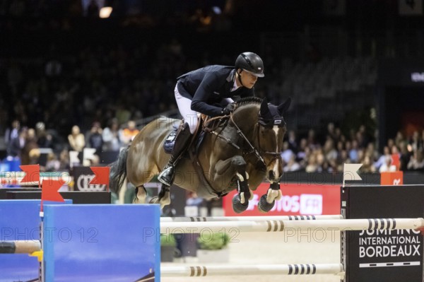 Max Kuhner of Austria competes in the Audi Grand Prix equestrian event at Jumping International