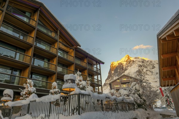 House and Mountain Peak in the Swiss Alps in a Snowy Winter Day in Grindelwald, Canton Bern,