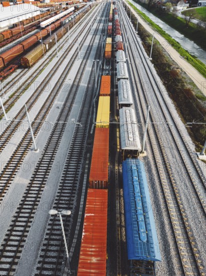 Cargo trains close-up. Aerial view of colorful freight trains on the railway station. Wagons with