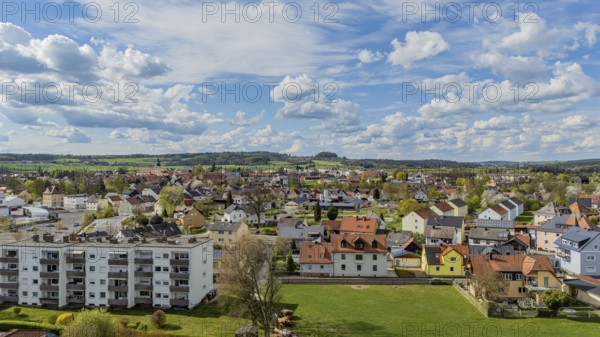 Urban landscape with varied roofs and green surroundings under a changing sky, Mitterteich, Upper
