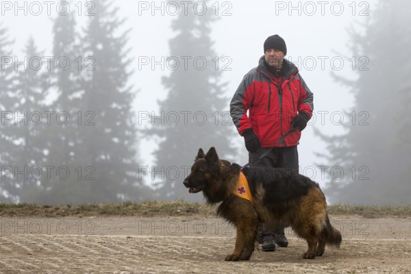 Sofia, Bulgaria - April 20, 2016: A man and his dog at the search and rescue team at Bulgarian Red